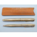 A hallmarked 9ct gold Parker 51 fountain pen and propelling pencil set