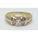 A 14ct gold ring set with a marquise cut diamond surrounded by round cut diamonds, 4.