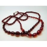 Two Bakelite cherry amber style faceted beaded necklaces.