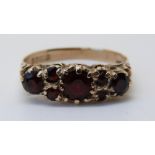 A 9ct gold ring set with garnets (size P)