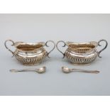 A pair of George V hallmarked silver twin handled open salts, Chester 1912/15, length 10cm,