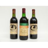 Three bottles of Welsh Rugby commemorative wine, two 1986 and one 1984,