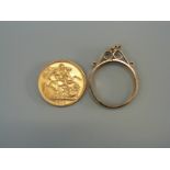 A 1910 Edward VII gold full sovereign and a mount to suit, 9.