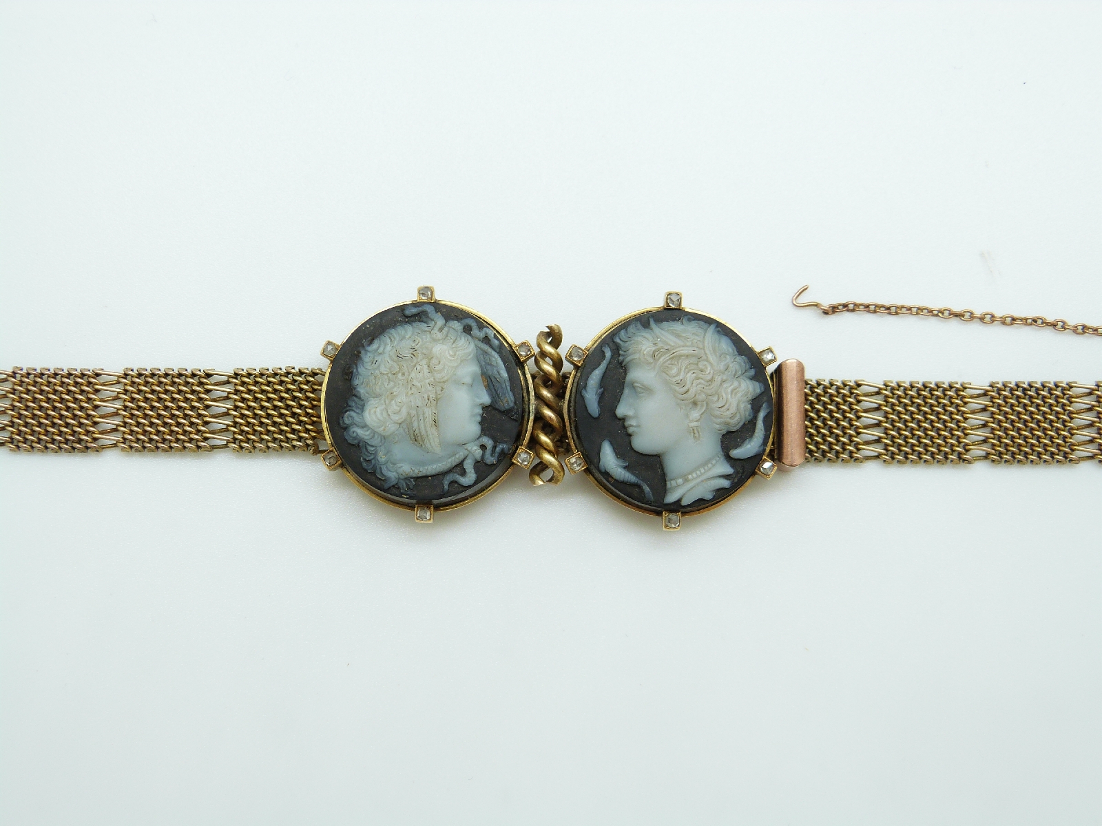 A 9ct gold Victorian bracelet set with two finely carved hardstone cameos depicting day and night, - Image 2 of 6