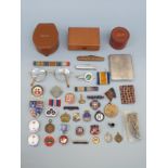 A group of small collectables to include badges, medal bar, pen knives, collar studs, watch chain,