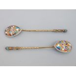 A pair of Russian silver spoons with a gilt finish, decorated with cloisonné enamel ,