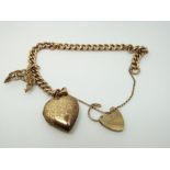 A 9ct gold curb link bracelet with a heart padlock