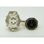 A silver ring set with a six sided mixed cut quartz and a silver ring set with enamel reading 'keep