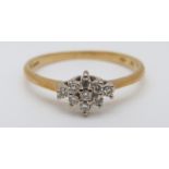 An 18ct gold ring set with diamonds in a cluster, 2.