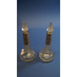 A pair of Edwardian silver mounted cut glass scent bottles, by William Devenport, Birmingham 1911,