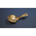 A George III silver caddy spoon, by I T, Birmingham 1810, having chased decoration, 8cm.