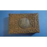 An eastern carved wooden cigarette box,