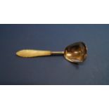 A Victorian silver caddy spoon, having mother of pearl handle, by Hilliard & Thomason,