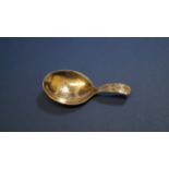 A George III silver caddy spoon, by George White, London 1798, having bright cut decoration, 7.2cm.