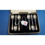 A cased set of six silver teaspoons and sugar tongs, by C W Fletcher & Son Ltd, Sheffield 1935, 89g.