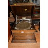 An oak cased Columbia Graffanola tabletop gramophone.