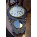 A reproduction ebonized drop dial wall clock.