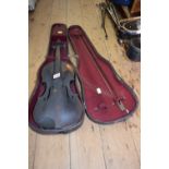 An antique Continental violin, with 14 inch back, cased and with bow.