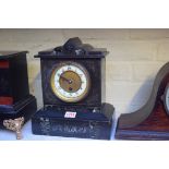 A slate and green marble mantel timepiece, 28cm high.