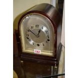 An early 20th century mahogany mantel clock,