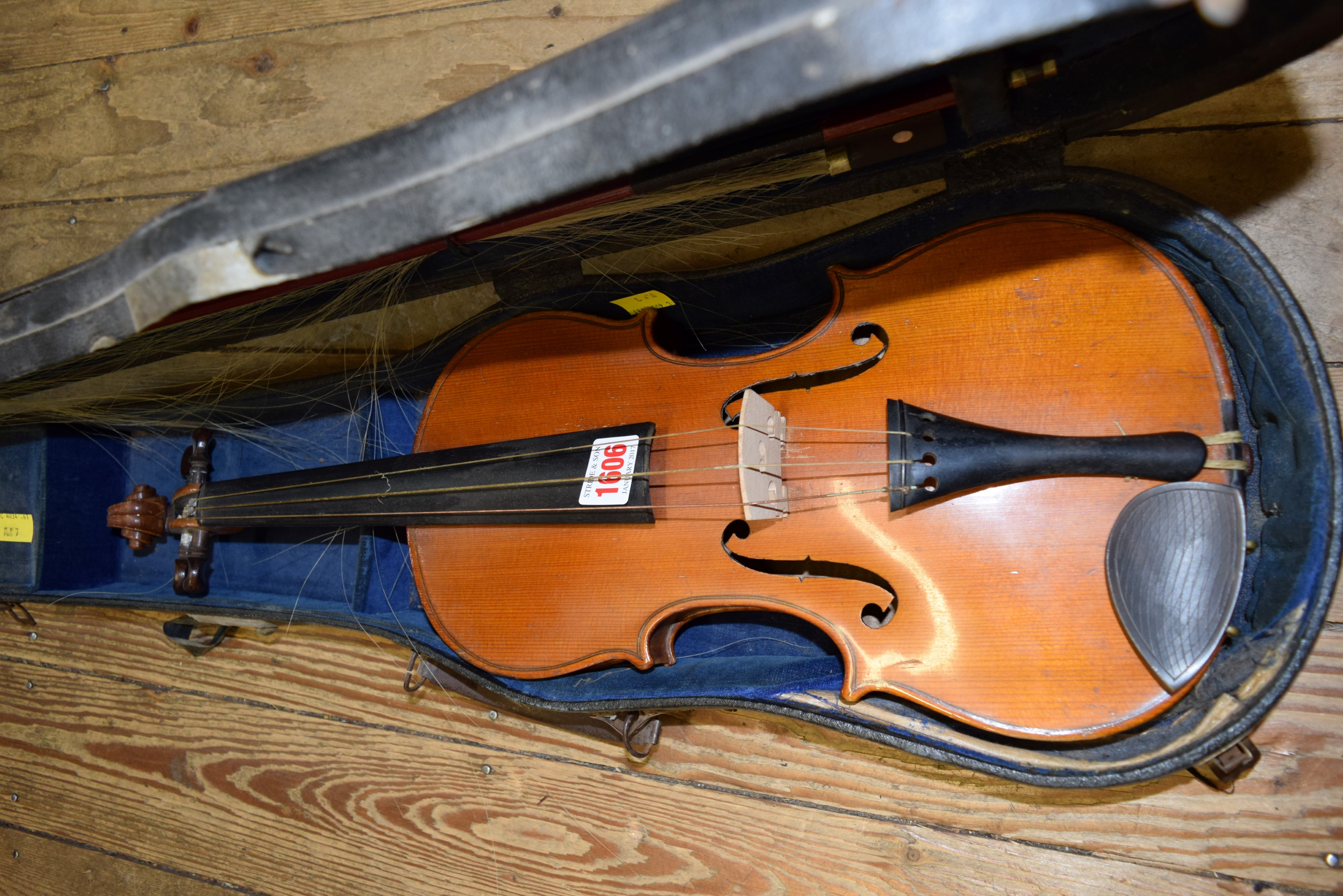 An early 20th century Continental violin, with 14 inch back, cased and with bow.