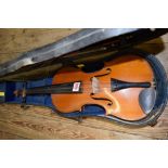 An early 20th century Continental violin, with 14 inch back, cased and with bow.