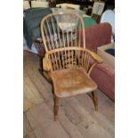 A mid-19th century ash, elm and beech wood Windsor armchair.