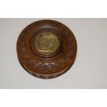 A carved treen carved circular snuff box and cover,