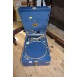 A blue HMV Model 101 portable gramophone.