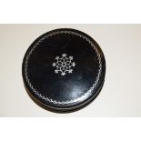 A 19th century Continental circular papier-mache tobacco box and cover, with pewter inlay, 7.