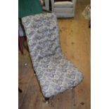 A Victorian walnut and upholstered slipper back nursing chair.