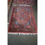 A North West Persian rug, with central geometric medallion, 152 x 100cm.