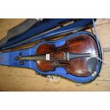 An antique Continental violin, with 14 inch back, in case and with bow; together with another viola,