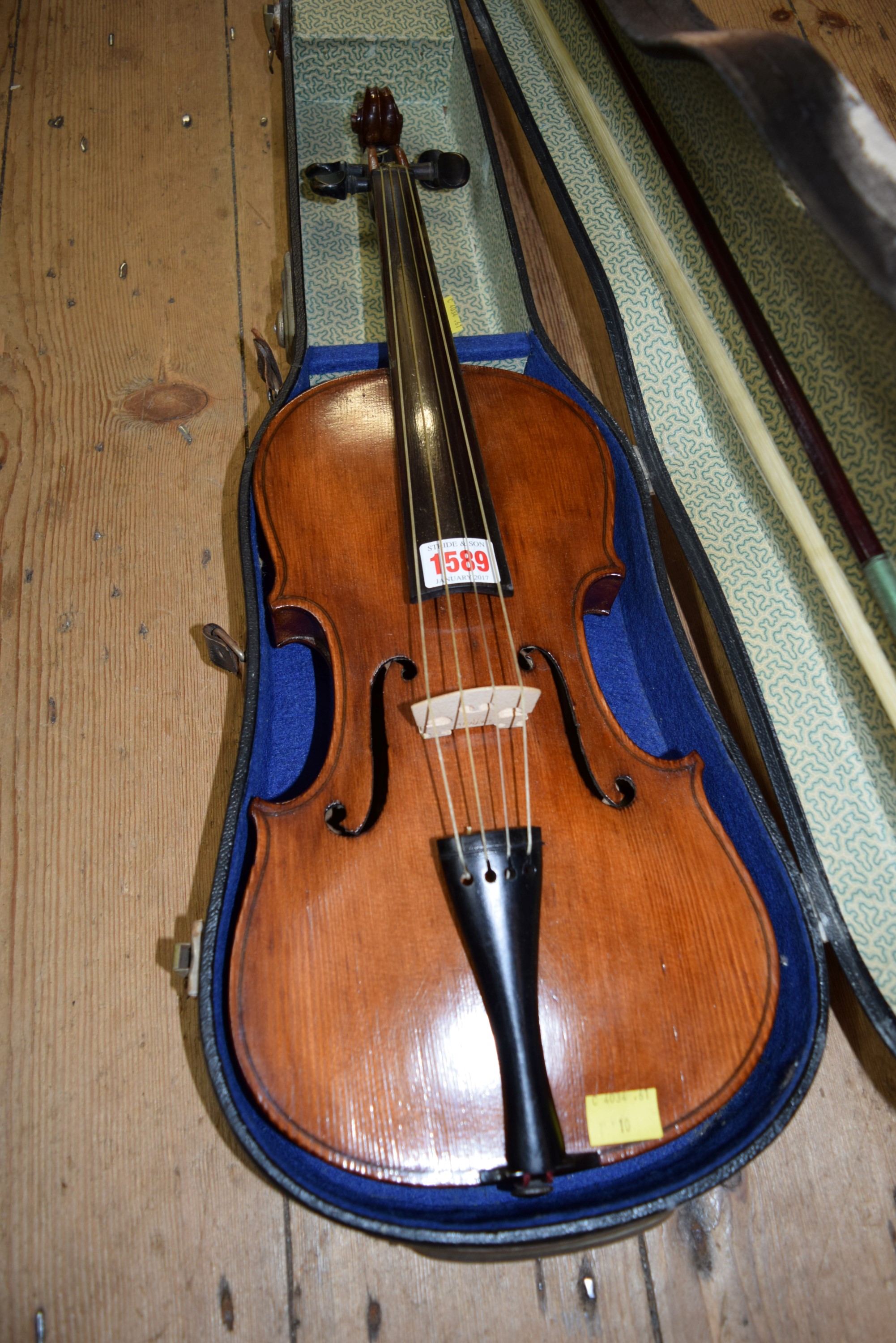 A German violin, with 14 inch back, cased and with bow.