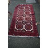 A Baluch rug, with allover Gul design; together with a Persian Hamadan mat, largest 190 x 98cm.