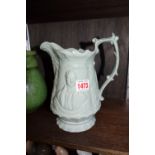 A Victorian Robert Peel jug, 21cm high; together with a Wemyss honey pot, 13cm wide, unmarked,