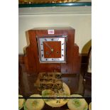 A 1930s walnut mantel clock, 34cm wide; together with a two train clock movement.