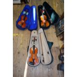 Three various children's violins, two with 12 inch backs and one with 12½ inch back,