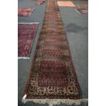 A very long and narrow Persian Hamadan runner,