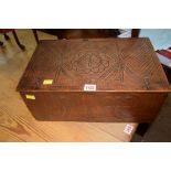 A late 19th century carved oak casket, possibly American, carved with stylized motifs, 42cm wide.