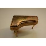 A novelty musical piano form compact, by Pygmalion.