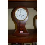 An Edwardian mahogany and inlaid balloon clock, 31cm high.