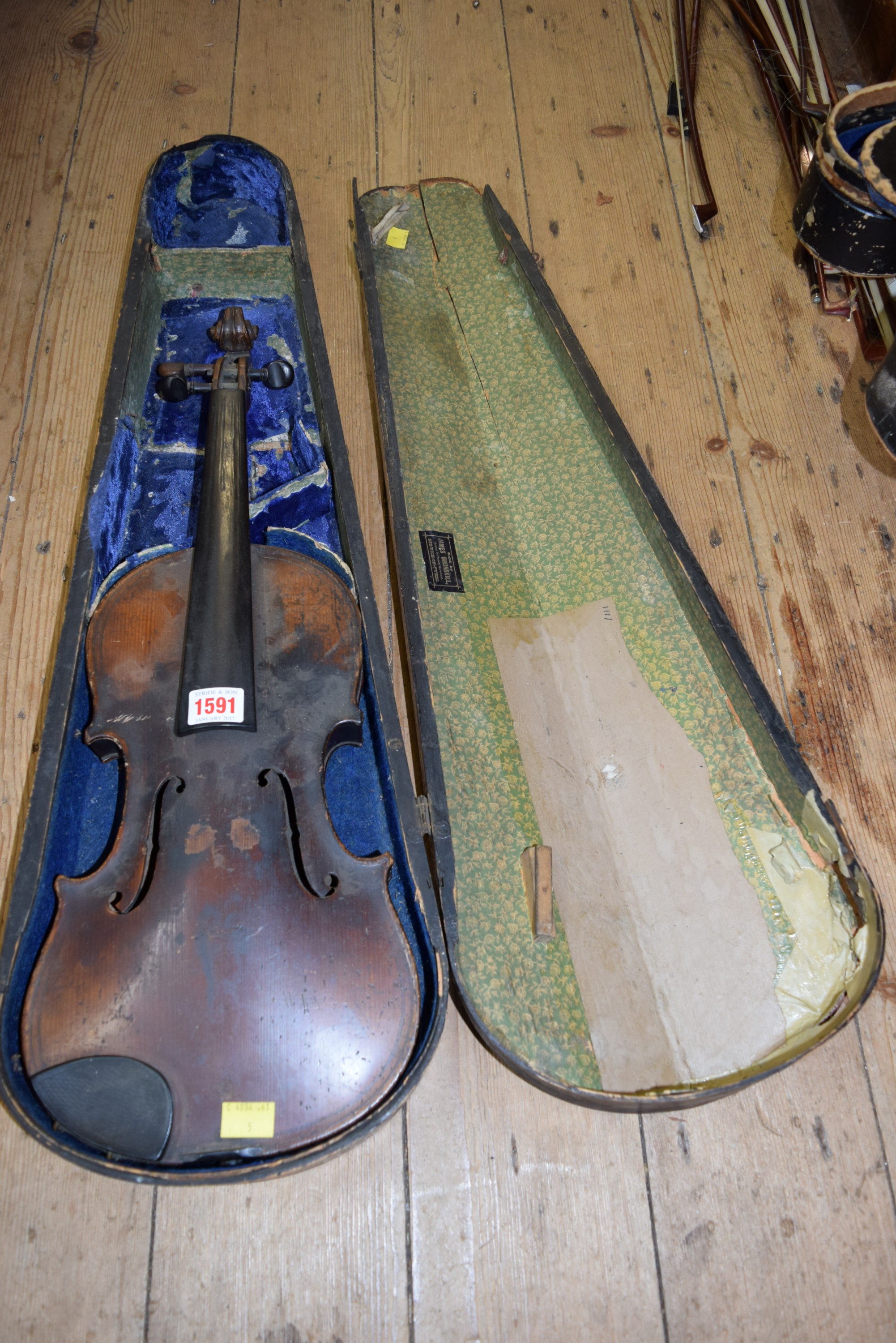 An antique Continental violin, with 14 inch back, labelled and stamped 'Maggini', in wood case.