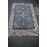 A machine made rug, having Chinese design, 178 x 118cm.