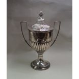 A large Edwardian silver twin handled trophy cup and cover, by Hawksworth Eyre & Co Ltd,