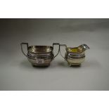 A silver twin handled sugar bowl and matching milk jug, by James Dixon & Sons Ltd, Sheffield 1933,