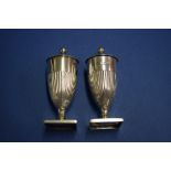 A pair of Edwardian silver urn shaped peppers, by Horace Woodward & Co Ltd, London 1903, 8cm, 69g.