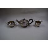 A silver three piece bachelor's tea set, by Elkington & Co, Birmingham 1921, 610g.