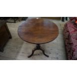 A George III mahogany circular tilt-top tripod table, 66cm diameter.