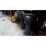 A pair of old lead planters and pedestals, total height 59.5cm high.